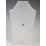 GRAHAM WILLIAMS, An 18ct white gold, peridot and diamond pendant, set with a faceted cushion-