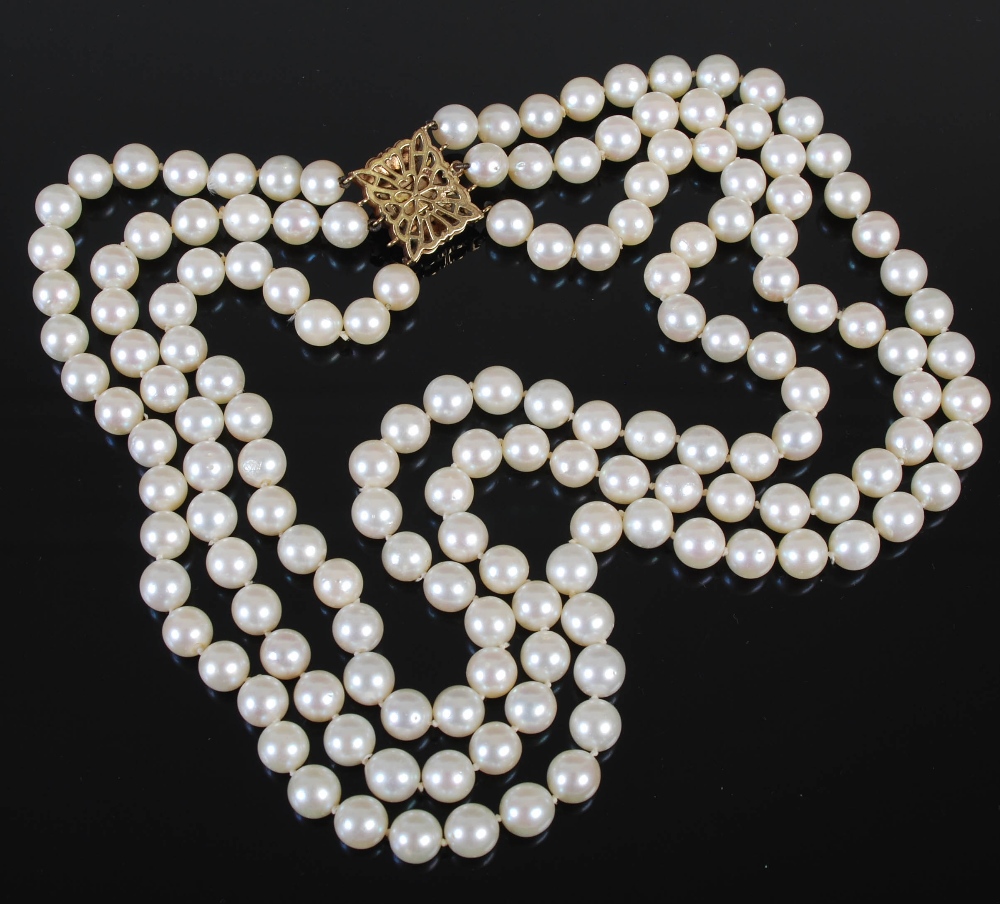 A cultured pearl necklet with 9ct gold and pearl set clasp, triple matinee length rows of forty- - Image 4 of 5