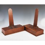 A pair of 19th century oak plate stands, with weighted rectangular bases, 42.5cm wide x 44.5cm