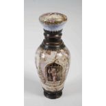 A late 19th century white metal mounted enamel scent bottle, the hinged cover opening to pull out