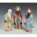 Three Chinese porcelain figure groups, early 20th century, one modelled as Shou Lao, the other two