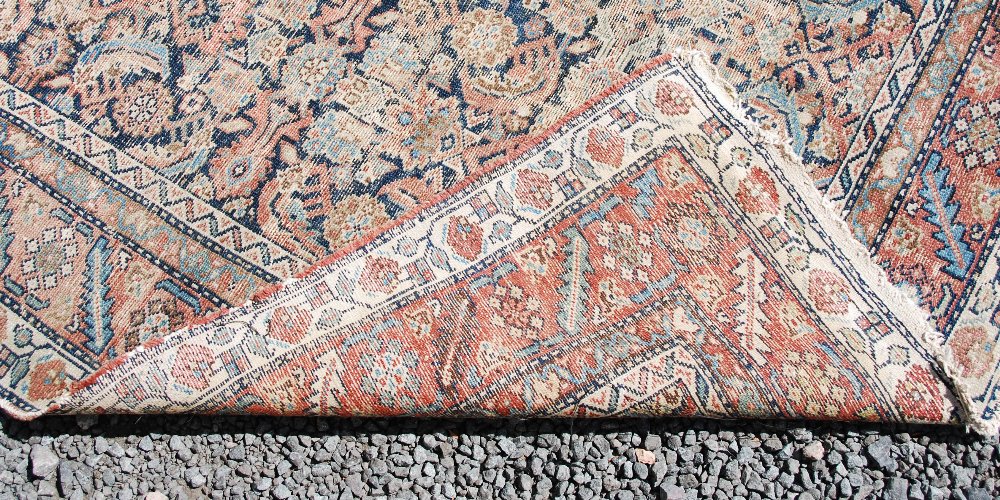 A Persian long rug and a Persian runner, the long rug with a blue rectangular field of stylised - Image 8 of 10