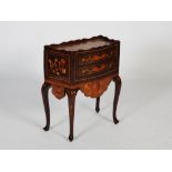 A 19th century Continental mahogany and marquetry inlaid bow front side cabinet, the shaped