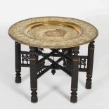 A late 19th/ early 20th century Middle Eastern brass topped occasional table, the detachable