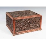 A Chinese carved wood dragon document box, Qing Dynasty, formed with five relief carved panels
