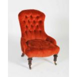 A 19th century mahogany nursing chair by Gillow, with later burnt orange button down velvet