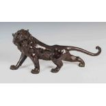 A Japanese bronze tiger, Meiji Period, signed, 55cm wide x 28.5cm high.