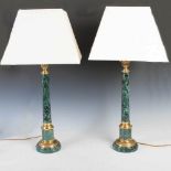 A pair of Regency style gilt metal mounted black and green marble table lamps, 20th century, with