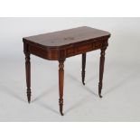 An early 19th century rosewood games table, the hinged top opening to a red baize lined interior