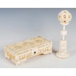 A Chinese ivory puzzle ball on stand and a Chinese ivory casket, Qing Dynasty, the puzzle ball on