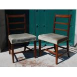 A set of six 19th Century mahogany dining chairs, with three horizontal splats and green upholstered