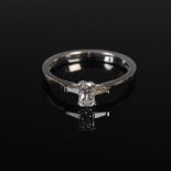 ANTWERP DIAMONDS, A platinum three stone diamond ring, centred with a phoenix cut diamond, estimated