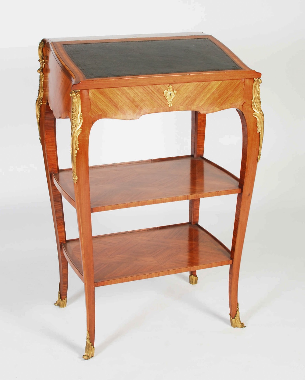 A kingwood and gilt metal mounted lectern in the Rococo style, the hinged rectangular top with green