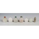 A collection of seven Chinese green polished stone snuff bottles, Qing Dynasty and later, to
