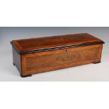 A 19th century rosewood and marquetry inlaid musical box, with 33cm long cylinder, change/repeat and
