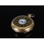 A yellow metal half hunter pocket watch, the outer cover with black enamel Roman numeral detail, the