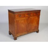 An early 19th century mahogany side cabinet, the rectangular top with moulded edge above an