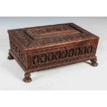 A 19th century Anglo-Indian sandalwood casket, the hinged cover centred with a rectangular panel
