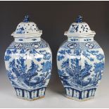 A pair of Chinese porcelain blue and white hexagonal shaped jars and covers, Qing Dynasty, decorated