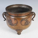A Japanese bronze two handled jardiniere, Meiji Period, decorated in relief with four heart shaped