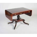 A 19th century Regency mahogany, boxwood lined and rosewood banded sofa table, the rectangular top