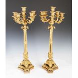 A pair of 19th century ormolu six light candelabra, the tapered cylindrical column supporting five