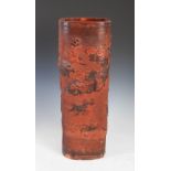 A Chinese terracotta stick stand, late 19th/ early 20th century, decorated in relief with dragon and