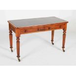 A 19th century mahogany library table in the manner of Gillows, the rectangular top with green and