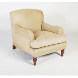 A 20th century club armchair in the style of Howard & Sons, the upholstered back, arms and loose