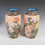 A pair of Japanese cloisonne coral ground vases, Meiji Period, decorated with flowering peony,