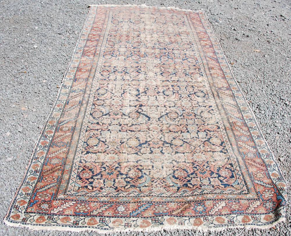 A Persian long rug and a Persian runner, the long rug with a blue rectangular field of stylised - Image 7 of 10