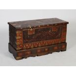 A 19th century Anglo-Indian brass bound chest on stand, the hinged rectangular top inlaid with