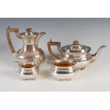 A George V four piece silver tea set, Birmingham, 1922, makers mark of MH&Co.Ld., oval shaped,