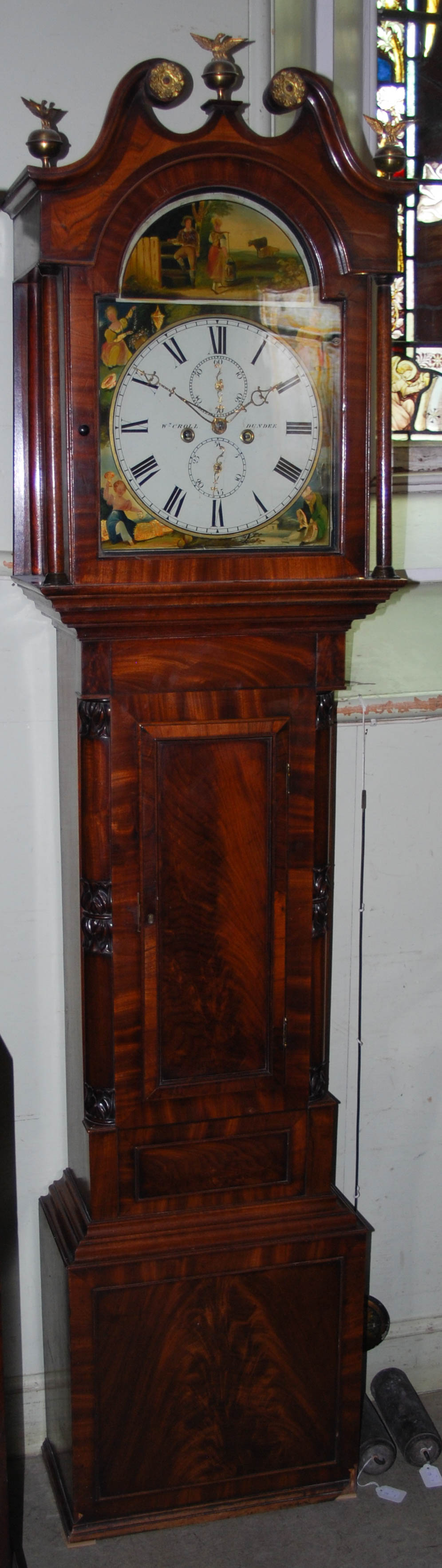 A 19th Century mahogany longcase clock, W.M.CROLL, DUNDEE, the enamel dial with Roman numerals,