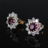 A pair of white and yellow metal ruby and diamond cluster earrings, circa 1970, each centred with