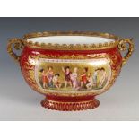 A 19th century Vienna porcelain ormolu mounted twin handled jardiniere, decorated with two named