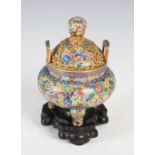 A Chinese cloisonne enamel and gilt metal twin handled tripod censer and cover, late Qing Dynasty,