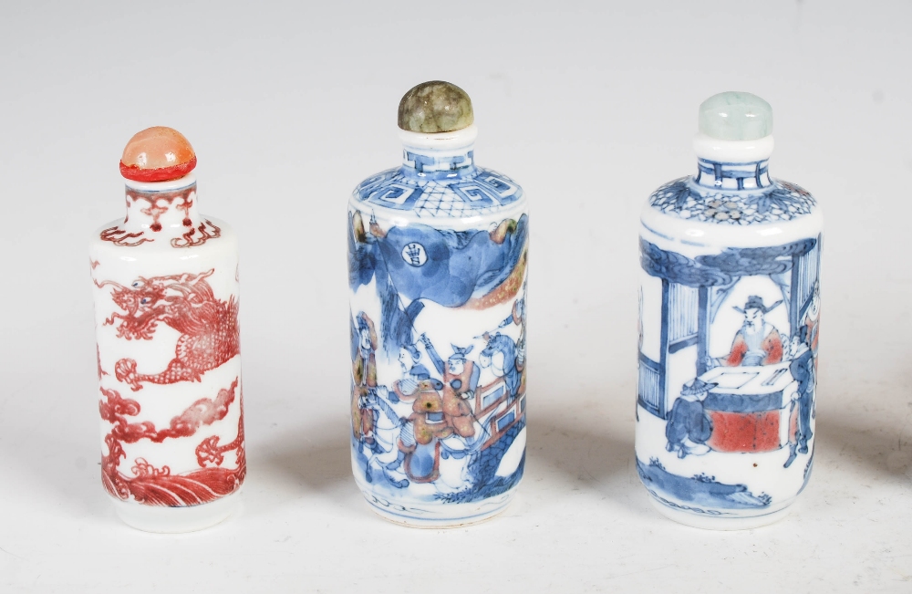 A collection of nine Chinese blue, white and copper red porcelain snuff bottles, to include; a - Image 2 of 4