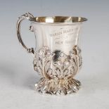 An Edwardian silver gilt Christening mug, Sheffield, 1902, makers mark of Walker & Hall, embossed