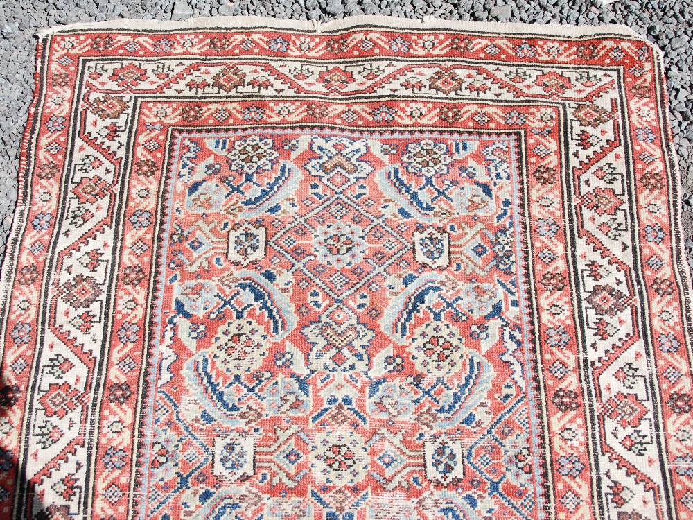 A Persian long rug and a Persian runner, the long rug with a blue rectangular field of stylised - Image 5 of 10