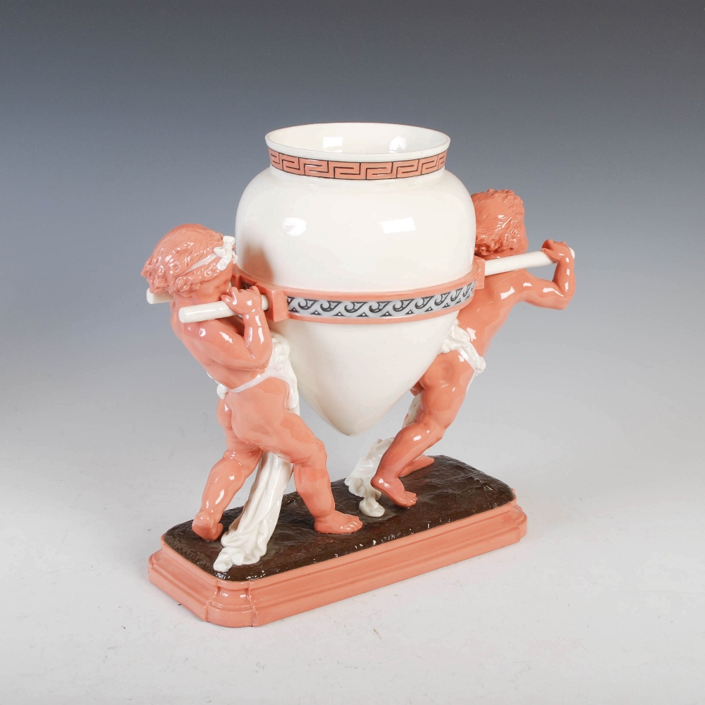A Mintons table centrepiece, modelled in the form of two putti carrying a Grecian urn, impressed - Image 2 of 7