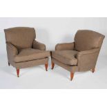 A pair of mahogany club armchairs in the style of Howard & Sons, the back, arms and loose cushion