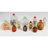 A collection of eight oversized and three other Chinese inside painted glass snuff bottles, the