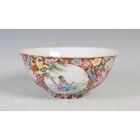 A Chinese porcelain famille rose millefleurs footed bowl, Qing Dynasty, decorated with three