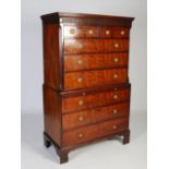 A George III mahogany chest on chest, the moulded and dentil cornice above a fretwork frieze, over