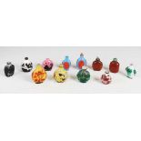 A collection of ten Chinese overlay glass snuff bottles and two monochrome glass snuff bottles, Qing