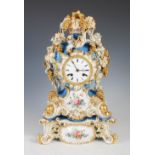 A late 19th century Jacob Petite porcelain mantel clock and stand, in the Rococo taste, the circular