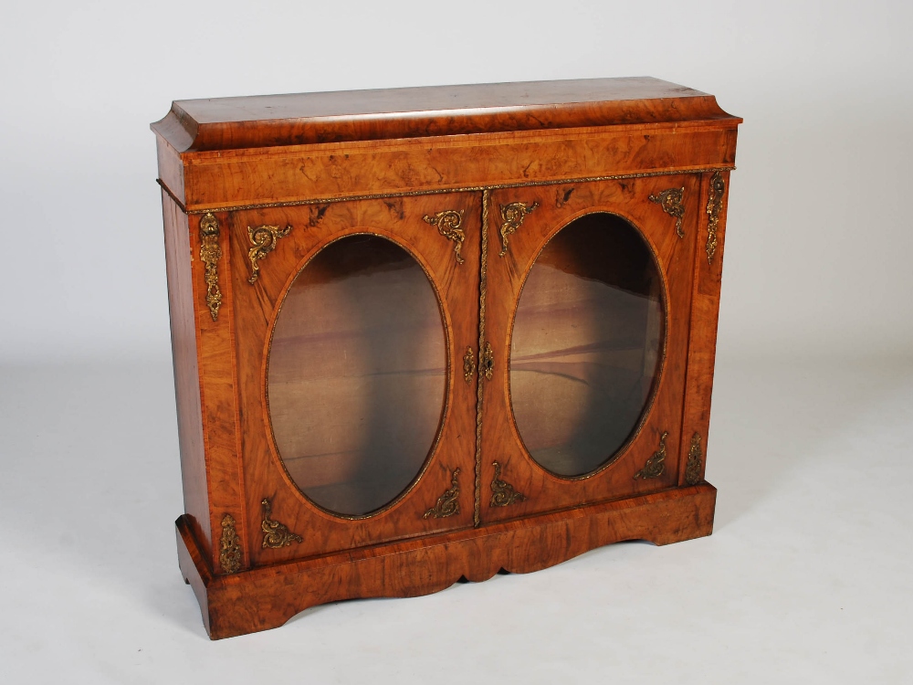 A Victorian walnut and gilt metal mounted credenza, the rectangular top and plain frieze above two