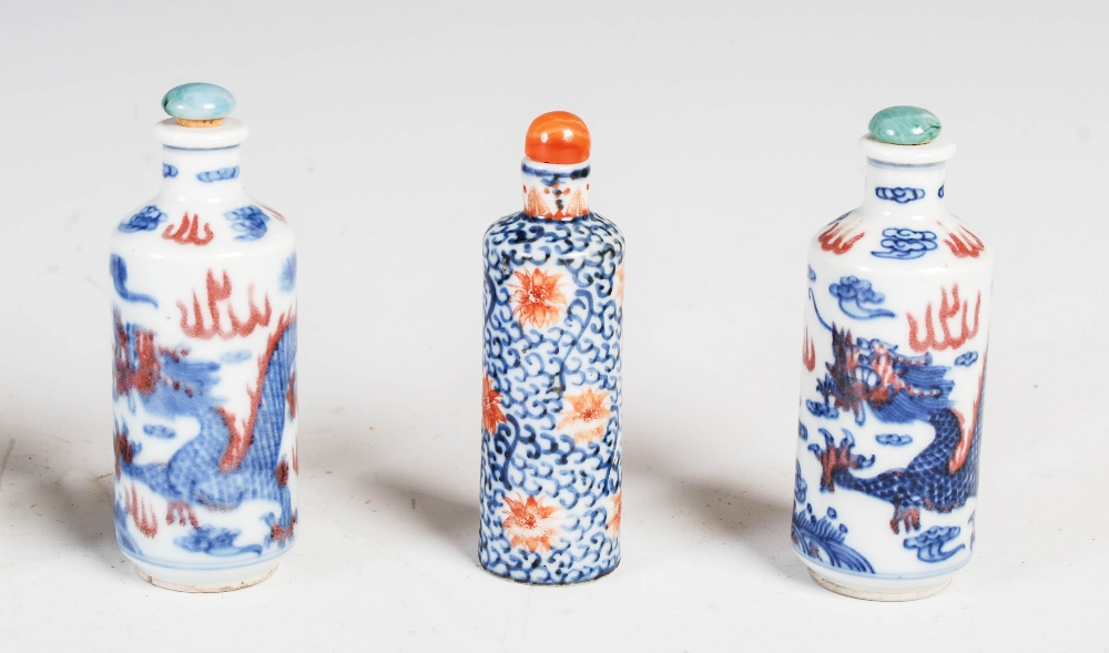 A collection of nine Chinese blue, white and copper red porcelain snuff bottles, to include; a - Image 4 of 4