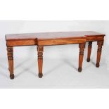 A 19th century mahogany breakfront console table, the faux marble top above a plain frieze with